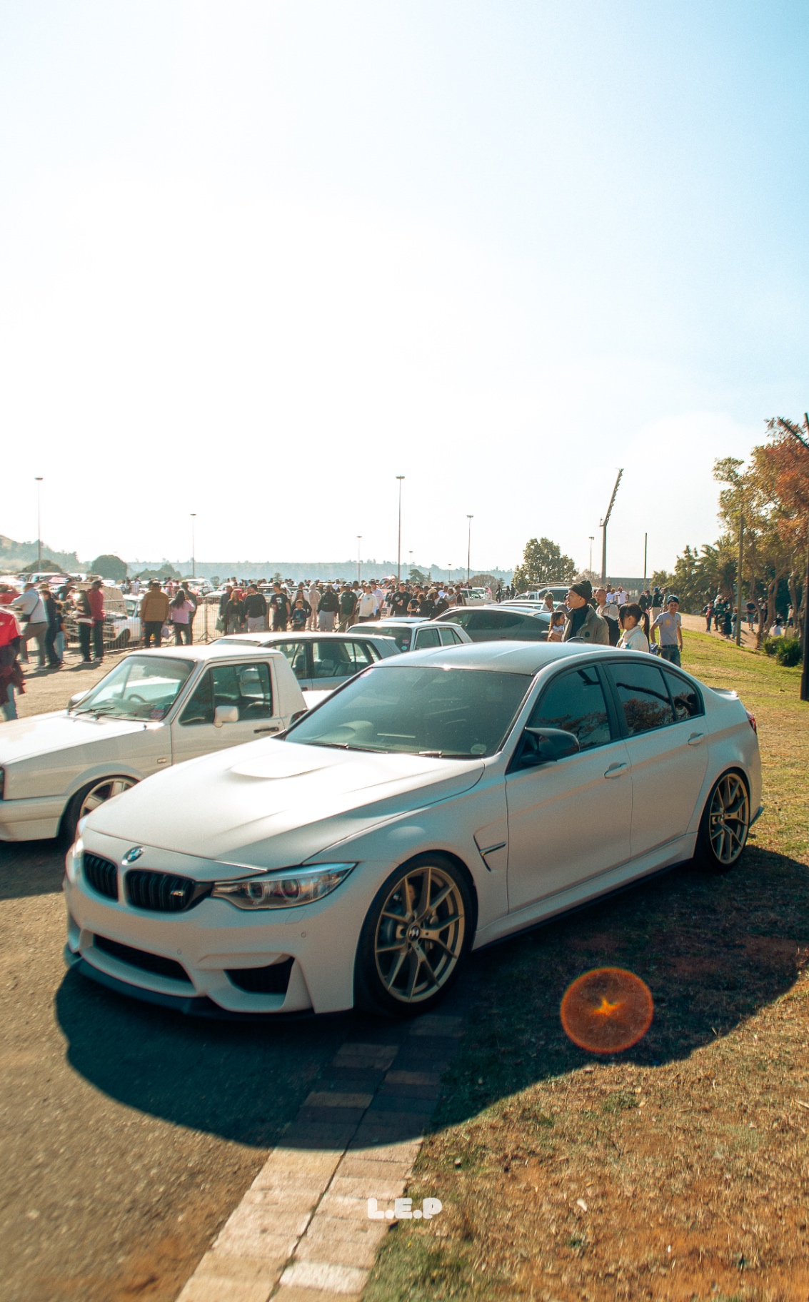 BMW F80 M3 at meet, crowd behind
